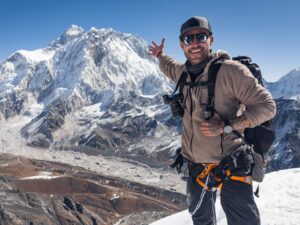 Man with camera gear while hiking in the mountains