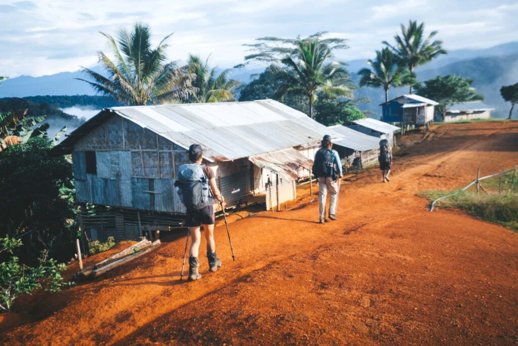 Trekkers walking on a road in PNG