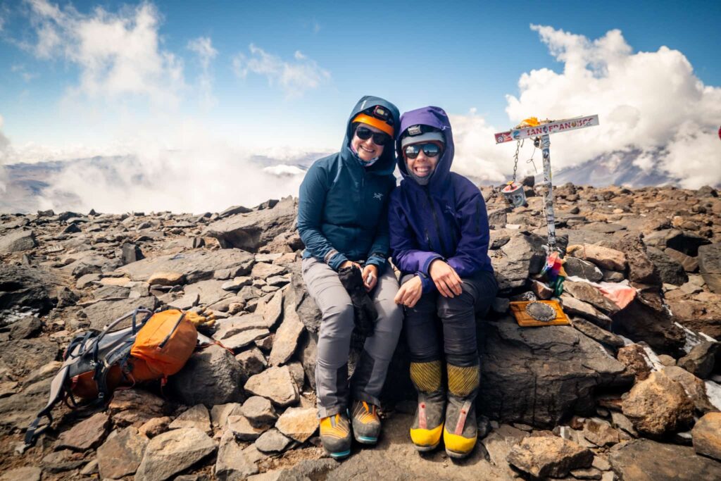 Hikers smiling for a photo in the mountains