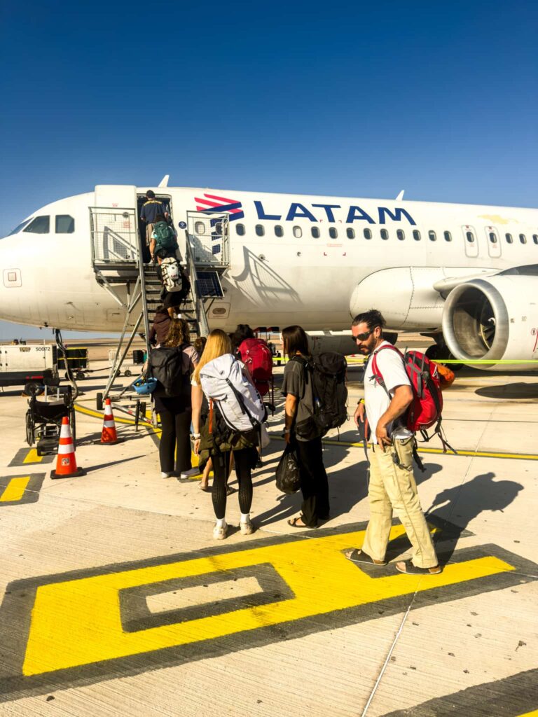 Travelers boarding a flight in Chile