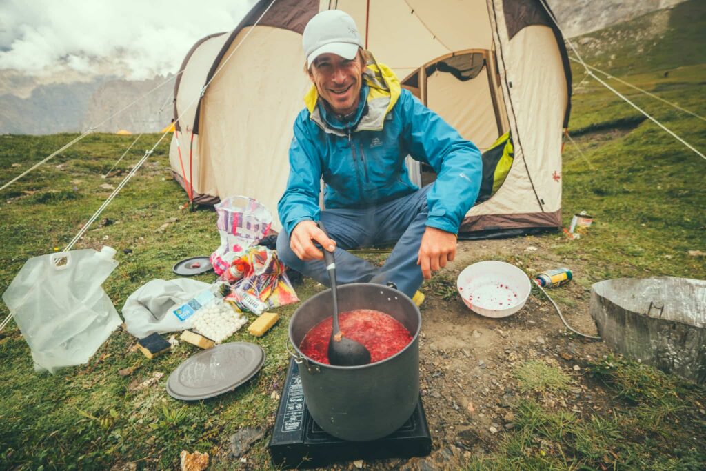 Hiker cooking in the mountains