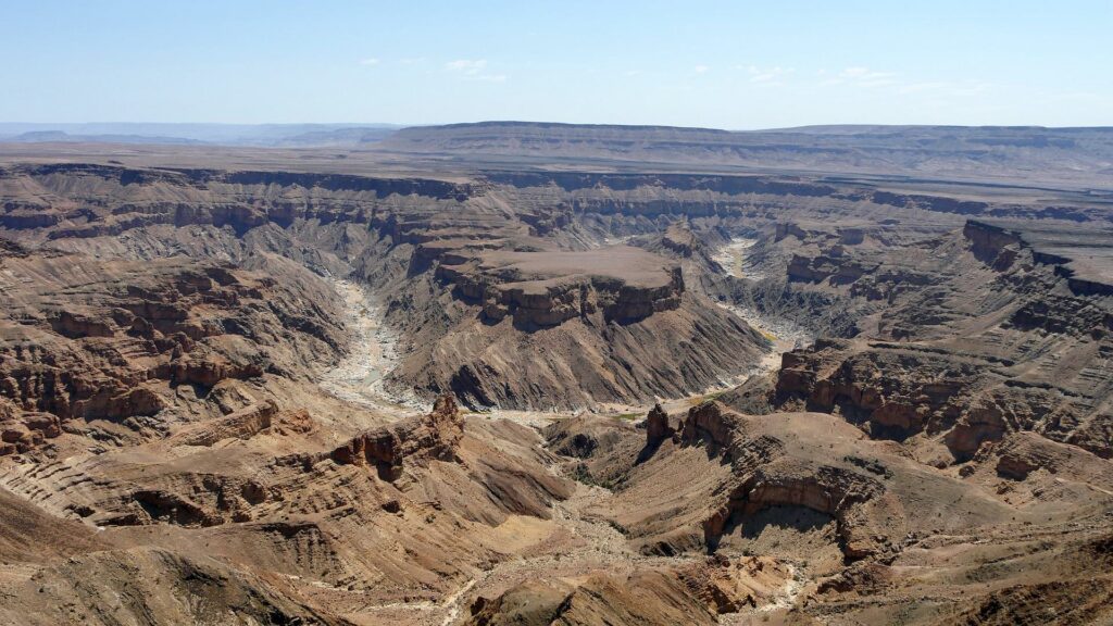 Fish River Canyon in Namibia seen from the rim, with the river winding along the canyon floor